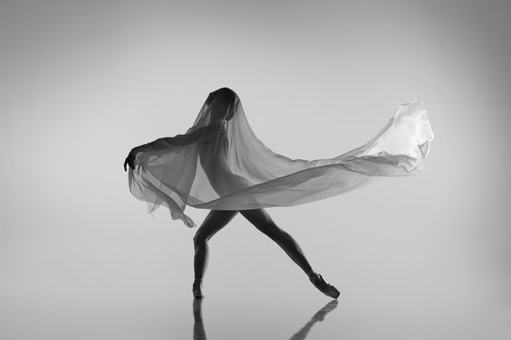 Portrait of young talented ballerina dancing, performing. Classic and modernity. Black and white